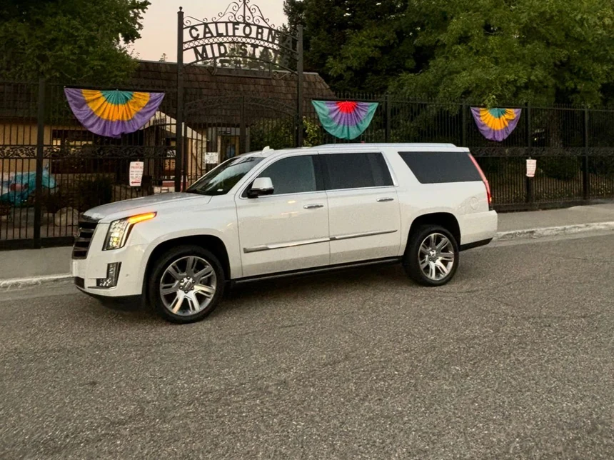 White luxury SUV at the California Mid-State Fair gate in Paso Robles